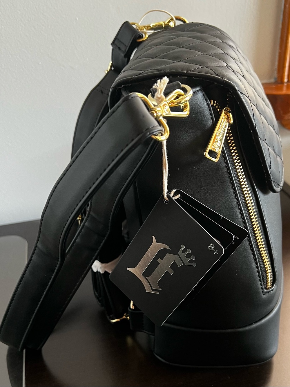 Loungefly Black Quilted Backpack with Gold Hardware Accents